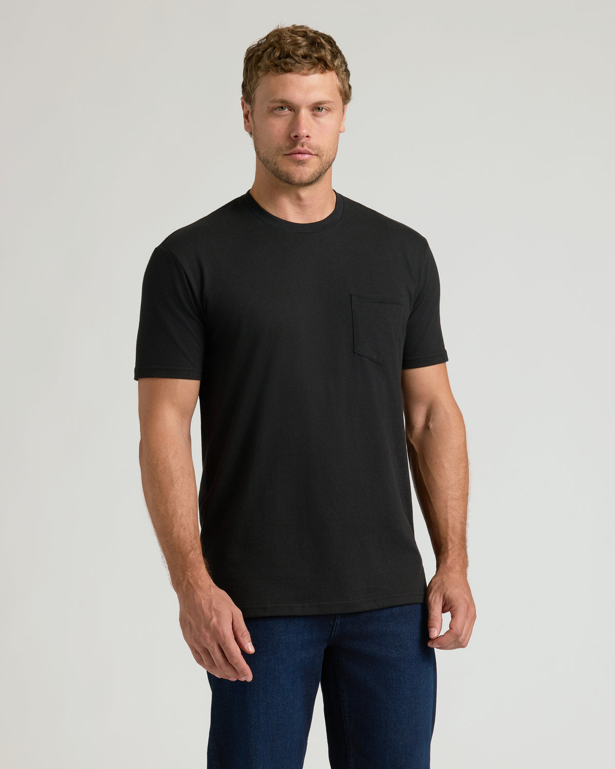 Black crew neck t-shirt with left chest pocket, short sleeves, regular fit.