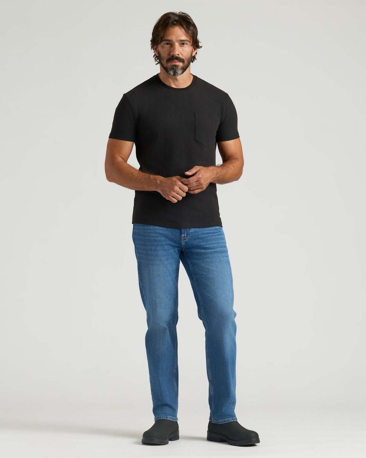 Man in Staple Heavyweight Pocket Crew T-shirt, straight-leg jeans.