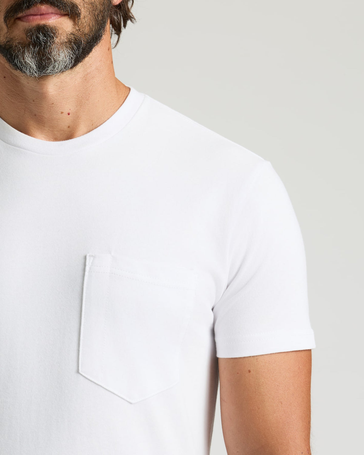 All White Heavyweight Pocket Crew Neck 6-Pack, featuring a durable chest pocket.