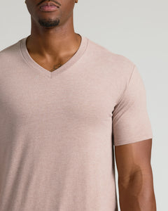 True ClassicLight Heather Slate Mauve Tall Classic V-Neck on medium-to-dark skin.