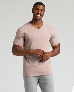 True ClassicMan modeling Light Heather Slate Mauve Tall Classic V-Neck and light gray jeans.