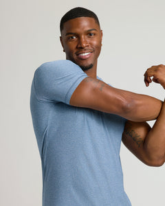 True ClassicHeather Azul Tall Active Crew Neck 2.0 on muscular man flexing, smiling.