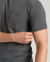 Carbon Tall Heavyweight Pocket Crew worn, showcasing sleeve adjustment and chest pocket.