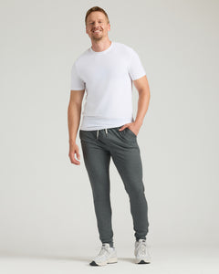 True ClassicTall man in Black & Charcoal Heather Gray Tall Active Joggers 2-Pack, smiling.