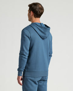True ClassicMan wearing a blue Fiord Fleece French Terry Pullover Hoodie shown from the back, highlighting the soft fabric and relaxed fit for casual men's basics.