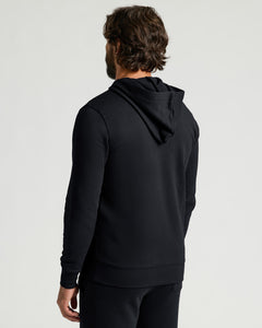 True ClassicBlack Fleece French Terry Pullover Hoodie shown from the back on a man featuring a hood long sleeves and a relaxed fit for mens basics style