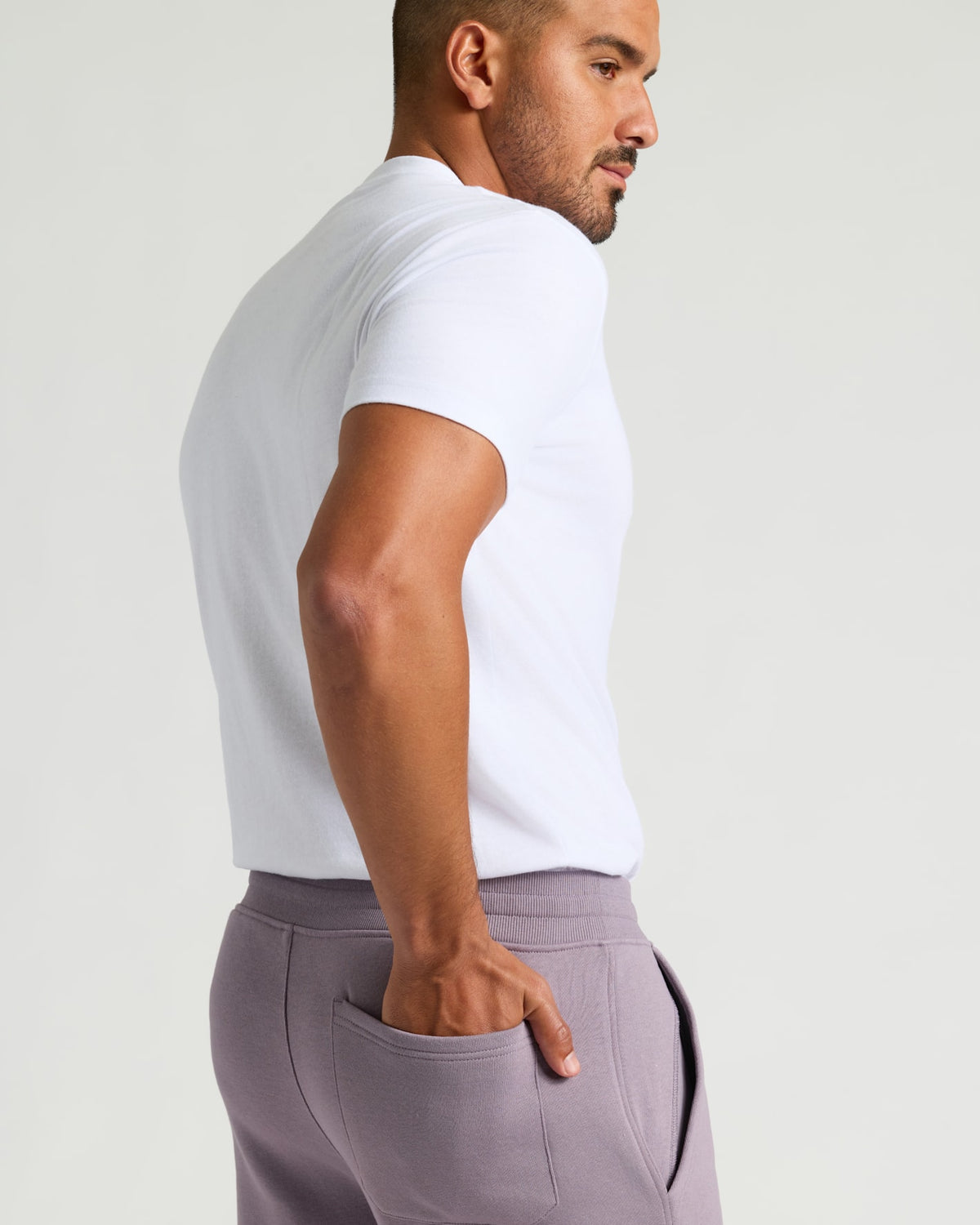 Man in Thistle Fleece French Terry Joggers with hand in pocket.