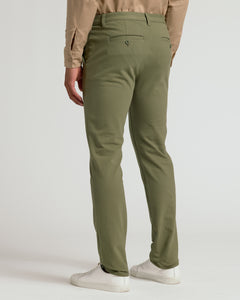 True ClassicMilitary Green Slim Chino Pants 2.0 with white sneakers.