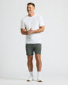 Man in Charcoal Heather Gray Active Comfort Shorts, white tee, and shoes.