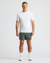 Man wearing 7 Carbon Active Training Shorts 2.0 and white T-shirt.