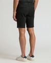 9 Navy & Black Chino Shorts 2-Pack with buttoned pockets and sneakers.