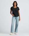 Woman in black Relaxed Slub Tee and jeans.