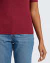 Womens Dark Maroon Ribbed 3/4 Sleeve Scoop Neck Tee tucked into jeans.
