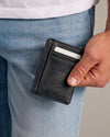 Black Classic Wallet in hand, showcasing vegan leather and card slots.