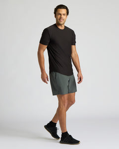 True ClassicMan wearing a black t-shirt and gray shorts on a white background