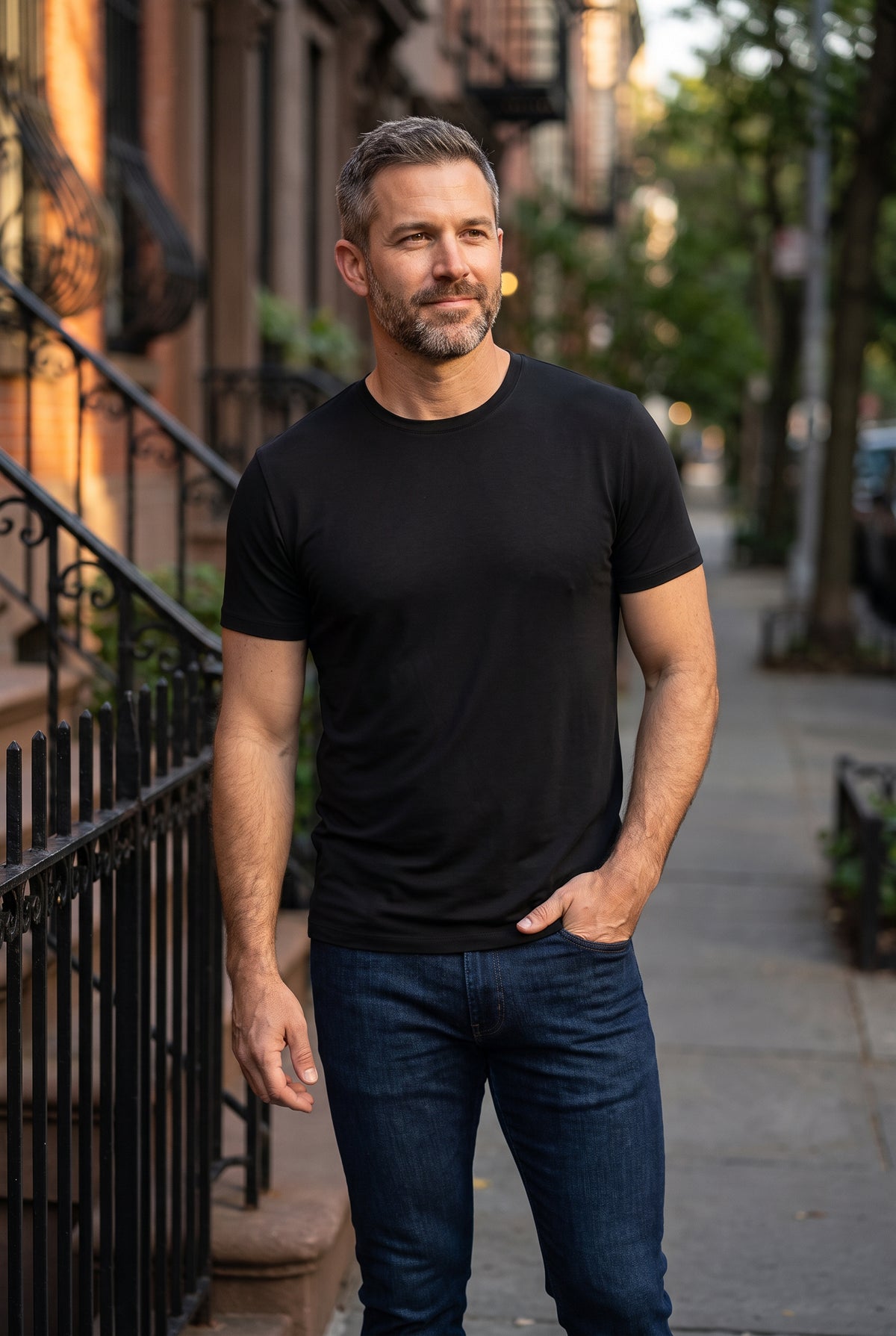 Classic Look - Crew, Jeans, & Boxers featuring a man in a black crew neck shirt and dark jeans on a city sidewalk, showcasing men's basics.