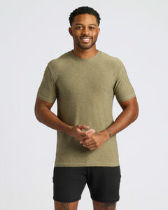 True ClassicMan wearing Heather Military Green Active Crew Neck Tee and black shorts, smiling.