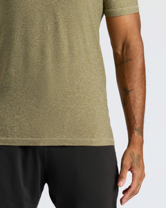 True ClassicHeather Military Green Active Crew Neck Tee worn with visible arm tattoos.