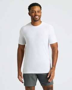 True ClassicMan in White Active Crew Neck Tee and olive-gray shorts, smiling.