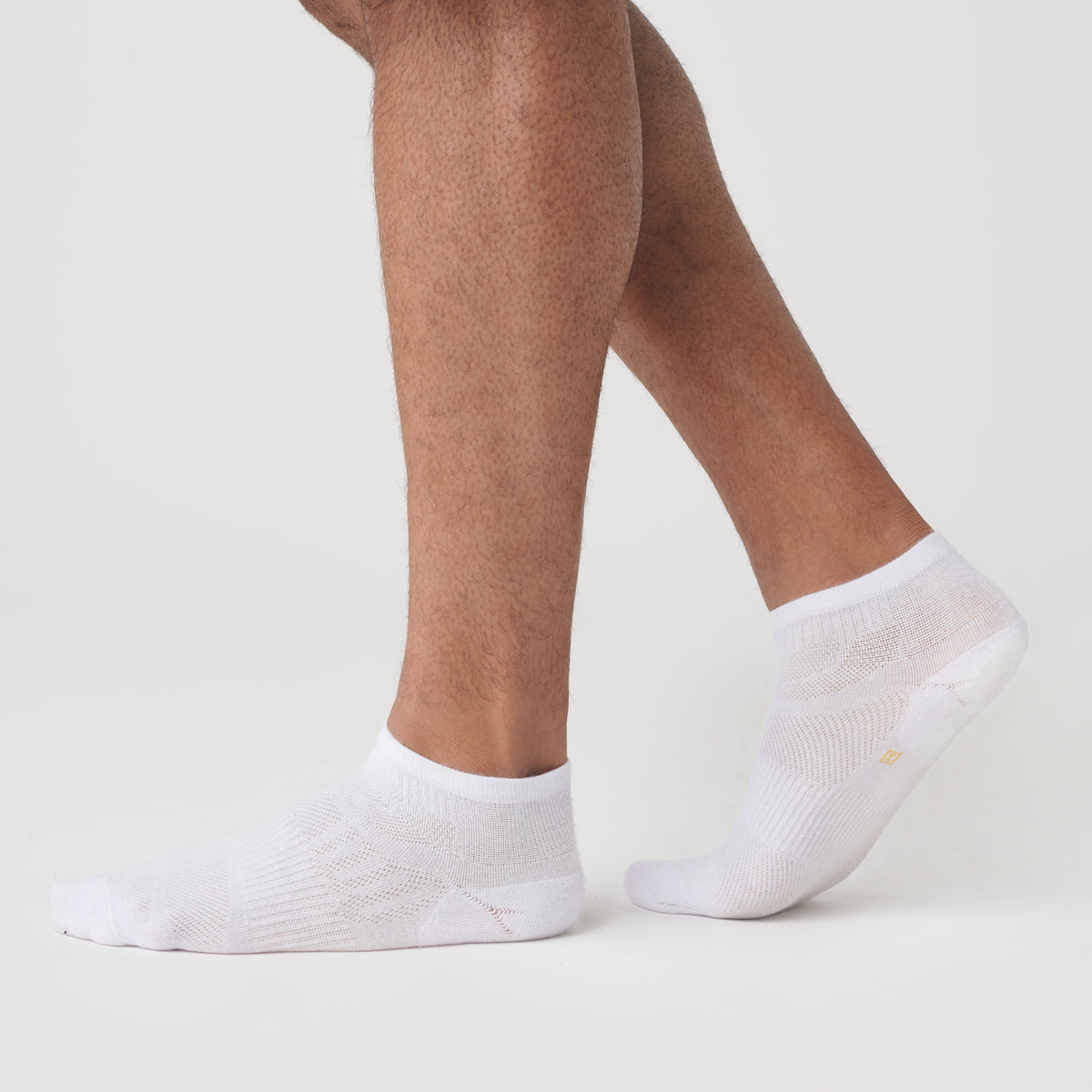 White Ankle Socks 3-Pack worn on feet, showcasing fit and design.