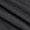 Carbon Short Sleeve Knit Shirt showcasing fine ribbed black textile and gentle folds.