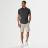 Carbon Short Sleeve Knit Shirt modeled with beige shorts and white sneakers.