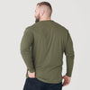 Man wearing Military Green Classic Long Sleeve Henley, hand in pocket.