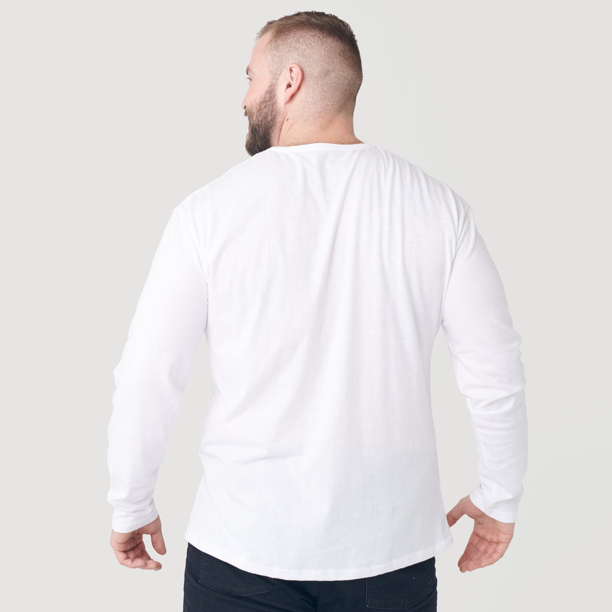 Back view of man wearing White Classic Long Sleeve Henley.