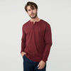 Man in Burgundy Classic Long Sleeve Henley and navy pants.