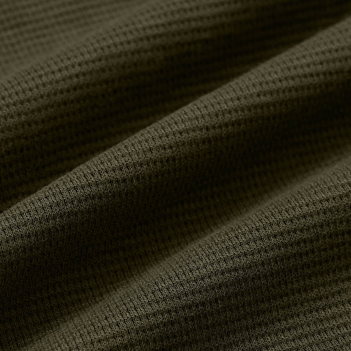 Military Green Waffle Hoodie close-up showing textured waffle-knit fabric.