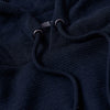 Navy Waffle Hoodie close-up, showing texture and drawcord details.
