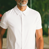 White Short Sleeve Knit Shirt worn by man, showcasing collar and buttons.